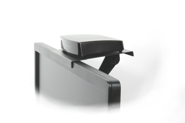 The IR T1 sits on a shelf on top of a flat screen TV.