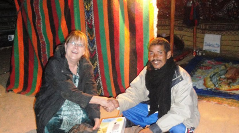 Dr. Gjertson meeting a man in Mali
